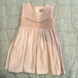 Light pink smocked dress.  Like new, never work without tags.